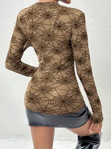 Back view of a sexy sheer mesh long sleeve top with a detailed spider web print