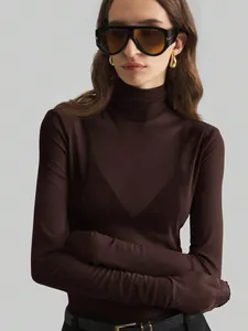 Detail view of a dark brown mesh turtleneck top with high-quality semi-sheer fabric.