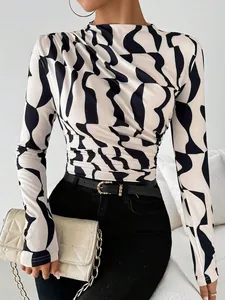 Slim fit long sleeve top with black and white abstract geometric print and stand collar.