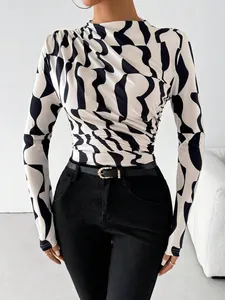 Slim fit mock neck long sleeve top with abstract black and white print and ruched detail