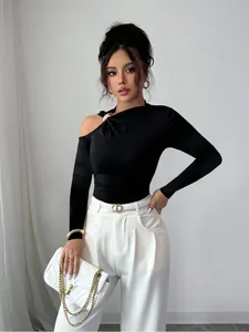 Chic black slim fit top with asymmetric neckline, cold shoulder and gold ring detail