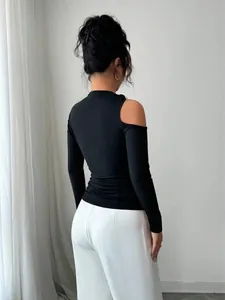 Back view of a black slim-fit top with a stylish asymmetric one-shoulder cutout detail.