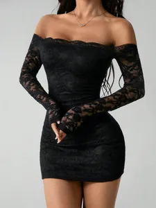 Close-up of elegant black lace off-the-shoulder long sleeve slim fit mini dress
