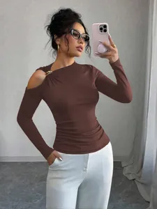 Detail view of brown slim-fit top with asymmetrical neck and cold-shoulder