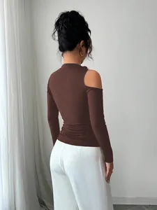 Detailed back view of a slim-fit brown asymmetrical cold-shoulder long sleeve top