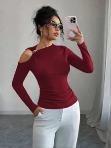 Detail of burgundy slim fit long sleeve top with asymmetrical cold shoulder metal ring