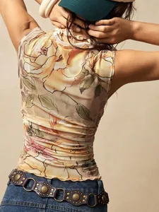 Back detail of a floral mesh sleeveless top with mock neck and slim fit silhouette