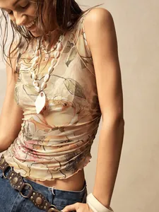 Detailed view of a vintage floral print mesh sleeveless top with mock neck detail