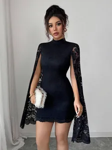 Detailed view of black lace mini dress with high collar and cape-style slit sleeves