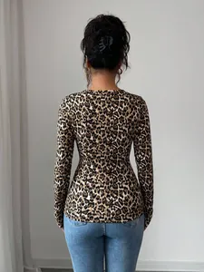 Detailed back view of a slim-fit leopard print long-sleeved top for women with blue jeans