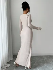 Detailed back view showcasing the unique texture of this elegant beige knit maxi dress