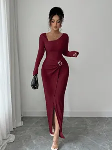 Close-up showing the unique knitted texture and asymmetrical neckline of this burgundy long dress