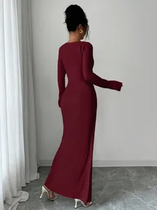 Elegant burgundy long sleeve textured knit maxi dress shown from the back for autumn