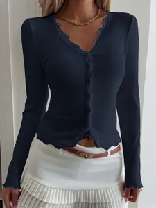 Elegant navy blue V-neck ribbed top with delicate lace trim and long sleeves for women