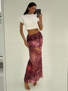 Full body view of a vintage print mesh fishtail skirt with high-waisted slim fit
