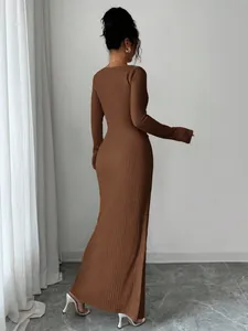 Detailed back view of a brown knitted texture long dress highlighting fit and fabric quality.