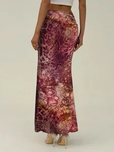 Close-up of vintage print mesh fishtail skirt showing slim fit and artistic script