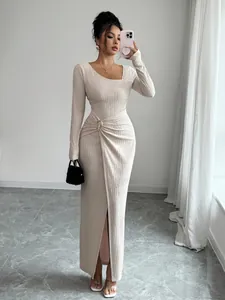 Elegant beige textured knitted maxi dress featuring an asymmetrical neckline and long sleeves
