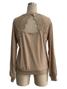 Detailed back view of a beige ribbed long sleeve T-shirt featuring elegant floral lace patchwork