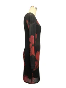 Side profile of elegant black mesh dress featuring vibrant red floral print design