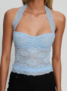 Detailed macro view of light blue floral lace halter neck camisole with ruched bust design
