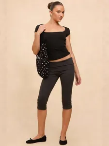Slim fit low waist capri pants and black square neck tee set for chic casual style.