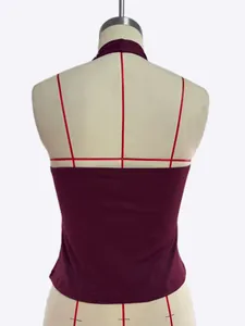 Back view of a burgundy tight halter camisole on a professional dress form