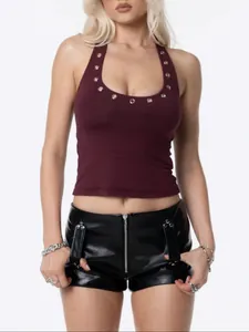 Close-up of maroon halter neck crop top featuring silver eyelet details on U-neckline.