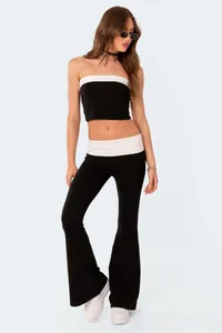 Stylish slim fit black flare pants with white fold-over waistband full body view