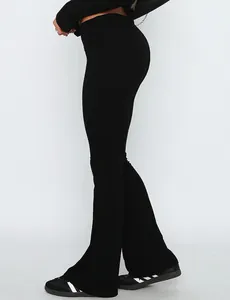 Side view of stylish black low waist flared trousers with slim fit bell-bottom design