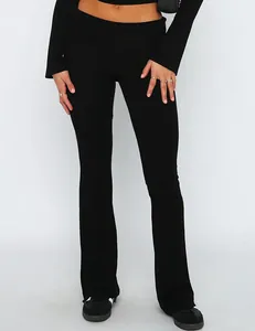 Detailed view of stylish low-waisted black flare pants providing a slim-fit elegant look