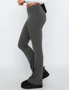 Side view of slim fit grey low waist flare yoga pants showing comfortable stretch fabric