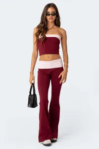Professional model wearing a maroon and pink tube top and low waist flared pants set