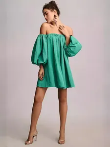 Elegant green off-the-shoulder puff sleeve mini dress for a stylish summer outfit