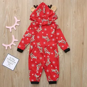 Detailed view of red Christmas baby hooded romper with cute reindeer and snowflake prints
