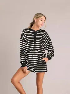 Chic black and white striped long sleeve top and matching shorts set for autumn commute.