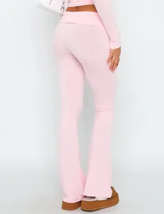 Detailed back view of stylish pink low-rise flare yoga pants with slim-fit design