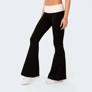 Fashionable low waist black flare pants for women with a stylish white fold-over waistband