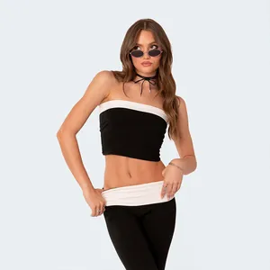 Stylish black and white two-piece set featuring a tube top and low-waist flared pants
