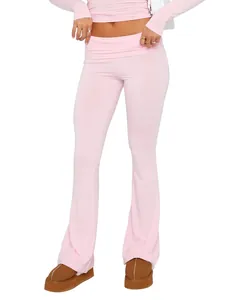 Close-up view of pink low-waisted flare leggings featuring a slim-fit fashion design.