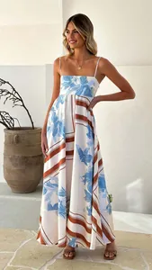Detailed view of an elegant floral print maxi dress featuring delicate camisole straps