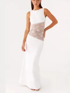 Elegant white satin maxi dress with floral lace waist insert and backless design