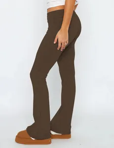 Detailed side view of trendy brown low-waist flare pants with a slim-fit comfortable cut