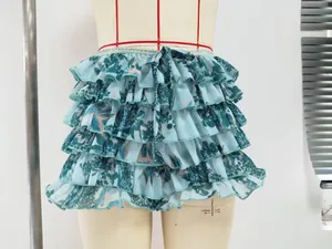 Detailed view of 2025 trendy blue floral multi-layered ruffled mini skirt shorts on mannequin