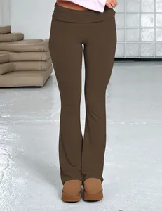 Detail view of women's brown low-waist flare pants showcasing the slim-fit design.