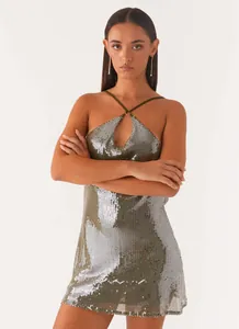 Detailed macro shot of shimmering sequin fabric on a sexy halter neck backless dress