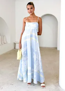 Elegant blue and white floral maxi dress with thin straps and a flowy A-line silhouette