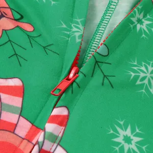 Close-up detail of smooth red zipper on green Christmas printed onesie family jumpsuit