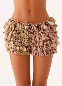 Close-up detail of sexy multi-layer ruffled mini skirt with chic pink leopard print design