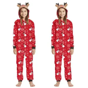 Full body view of red Christmas onesie with hood and reindeer ears on child model